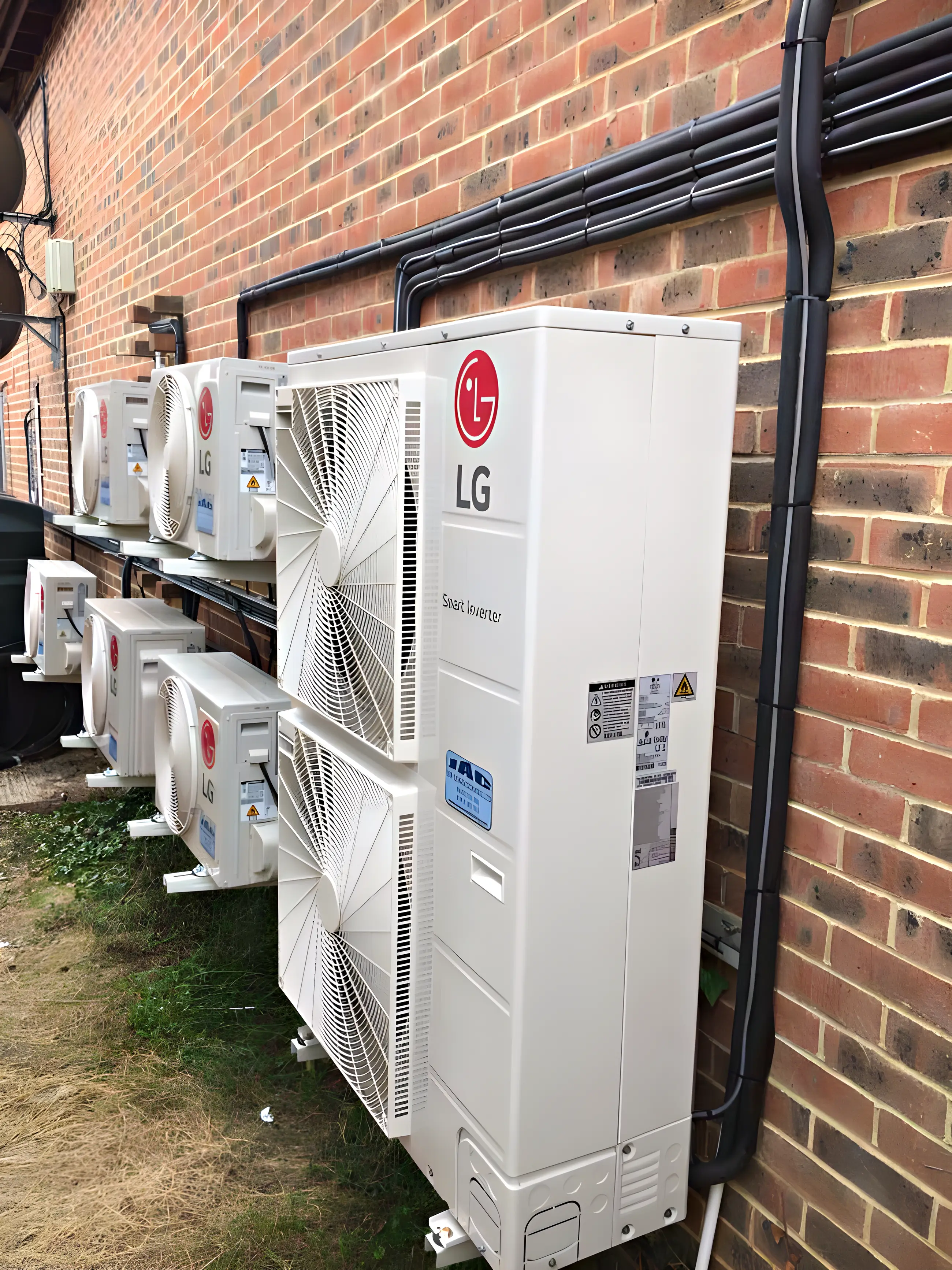 A bank of LG outdoor units on a commercial wall